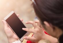 holding phone 16521575343x2 1